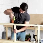 Man Using Guild Cordless Screwdriver – 3.6V Fast Charge for DIY Woodworking Project