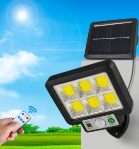 108COB LED solar wall light with motion sensor and remote control, split design with separate solar panel, mounted outdoors under bright blue sky