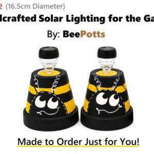 Handcrafted 16.5cm Dir BeePotts solar garden lights with black and yellow bee design on a white background.